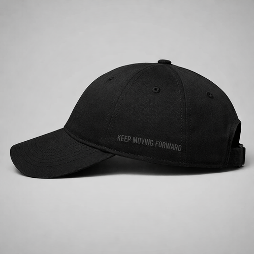Black baseball cap with black tonal writing on a white background